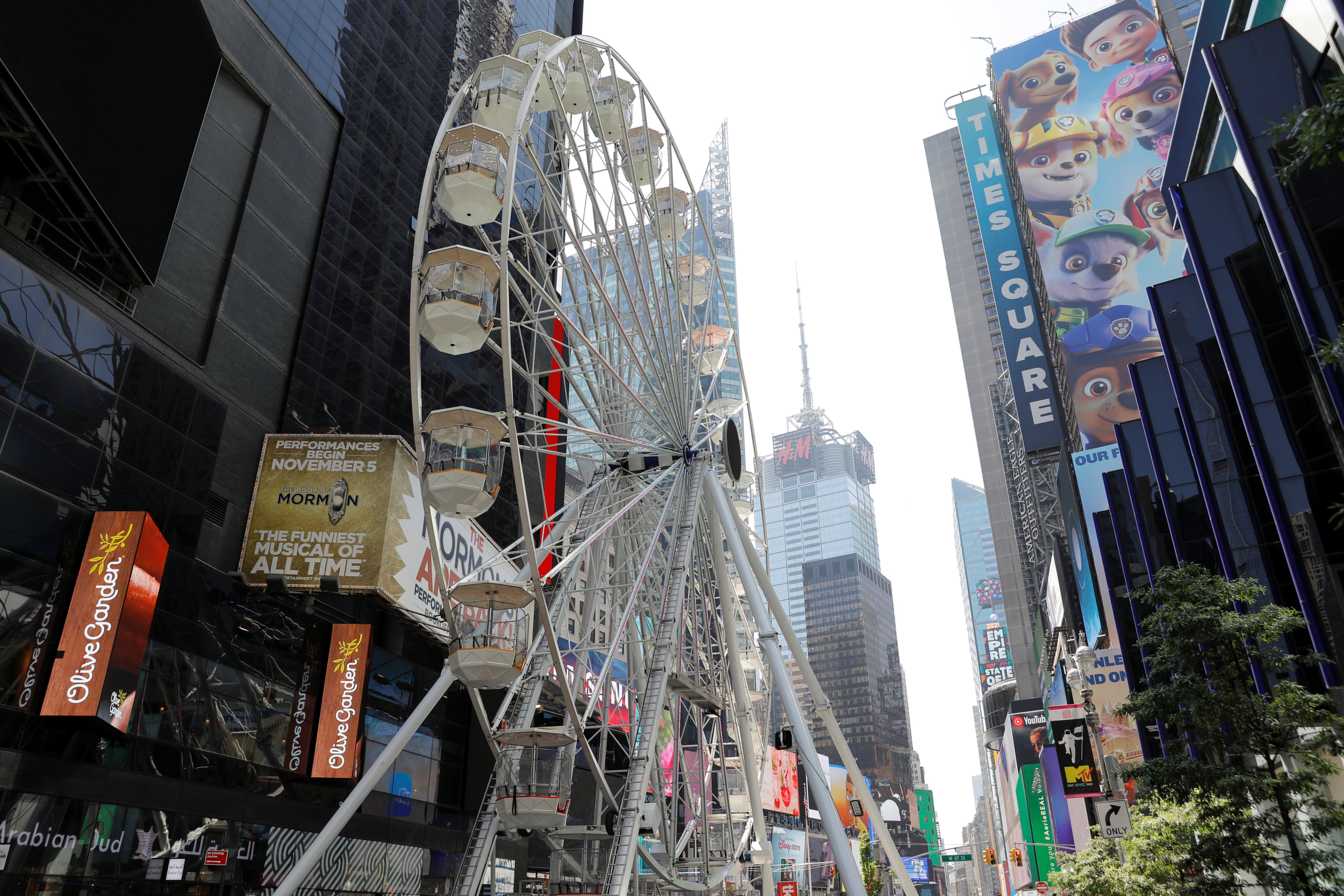 A Ferris wheel lifts spirits in New York’s Times Square