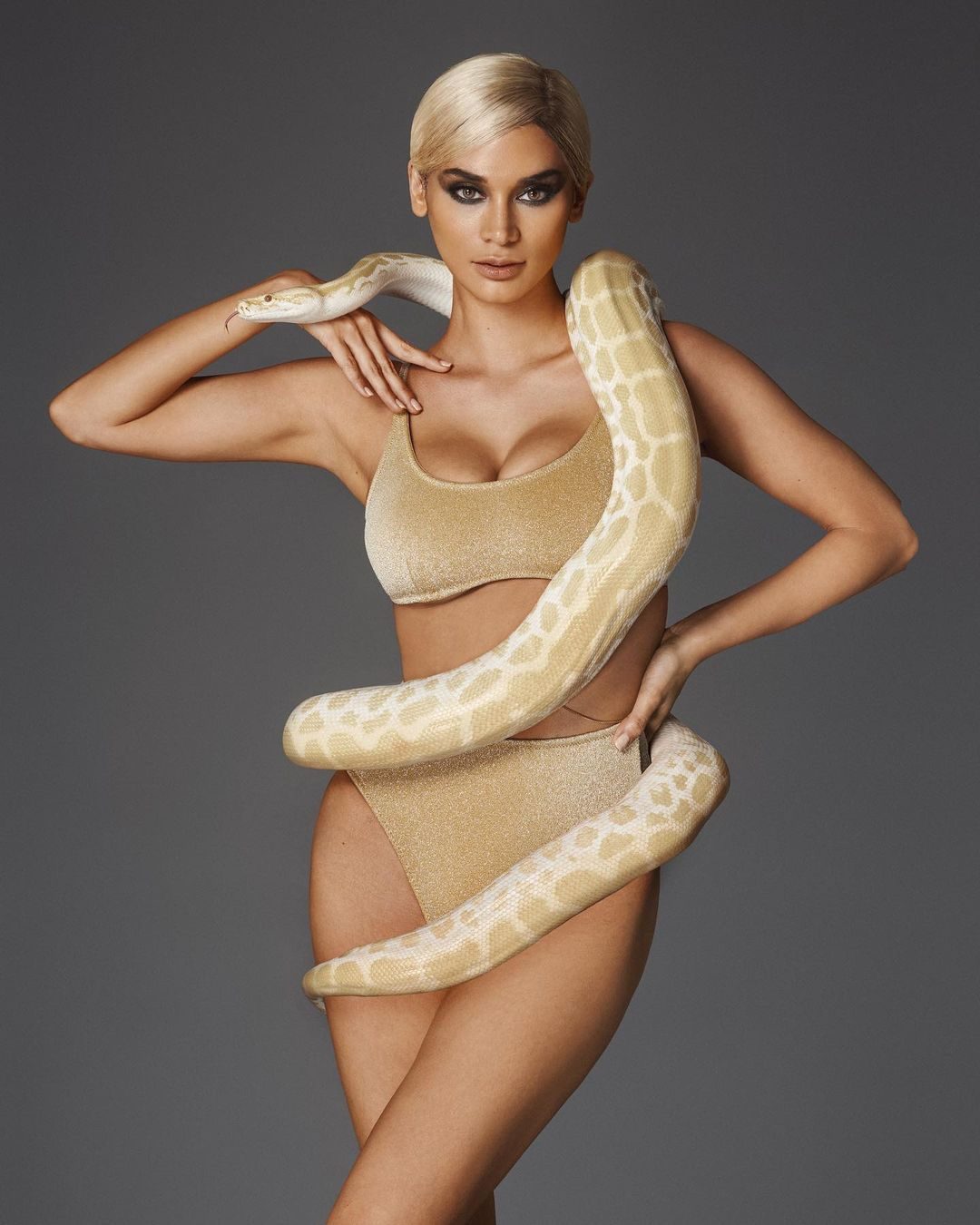 LOOK: Pia Wurtzbach channels Bettie Page, poses with live snakes in new photo shoot