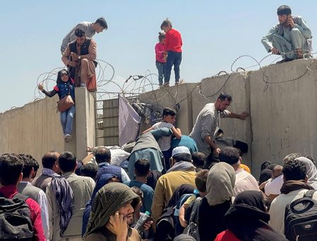 Desperate Afghans throng Kabul airport, stalling US evacuations