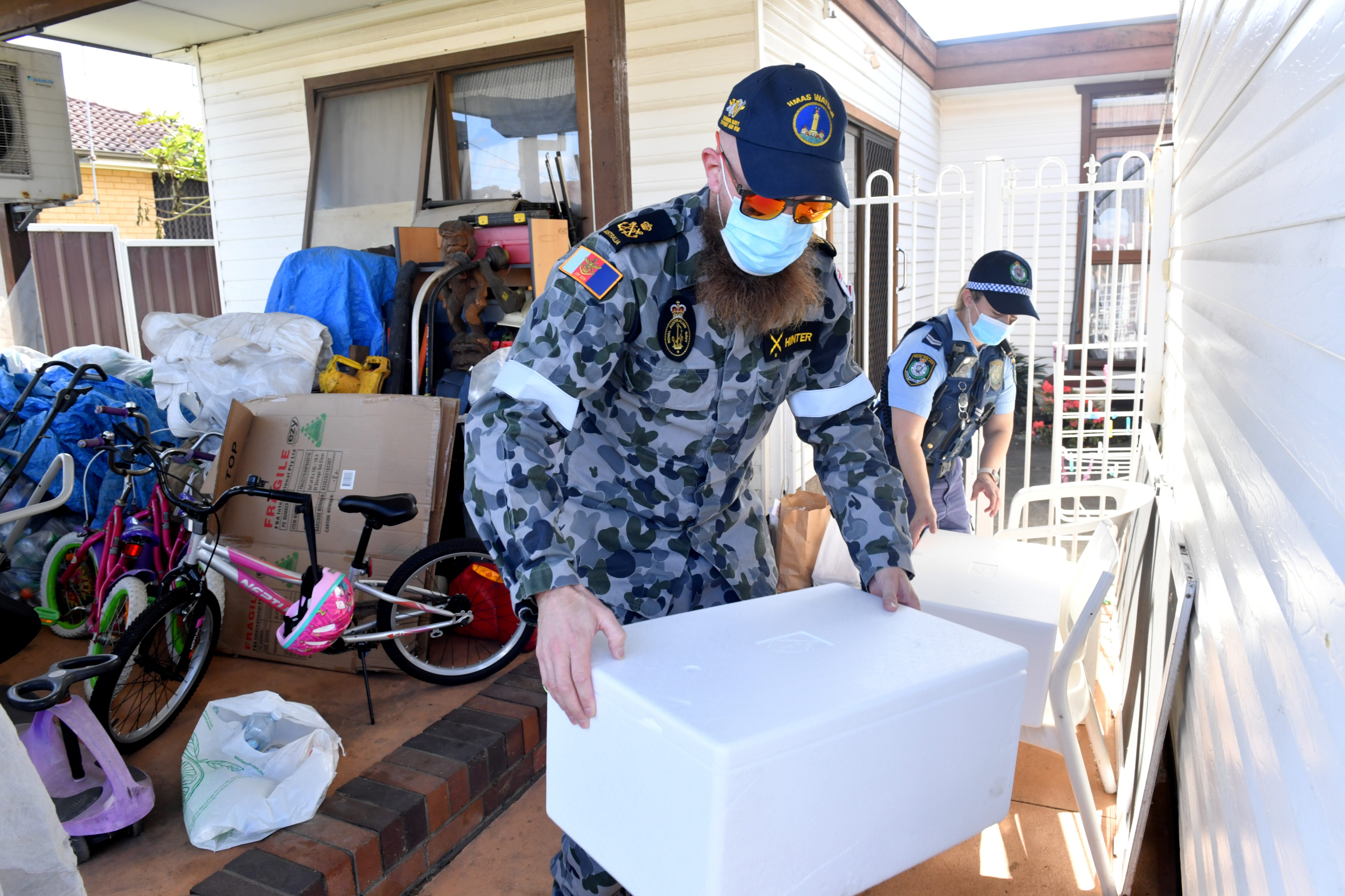 Australia tightens COVID-19 curbs as Brisbane extends lockdown, army patrols Sydney