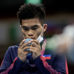 Carlo Paalam, a former scavenger, savors Olympic medal made from scraps