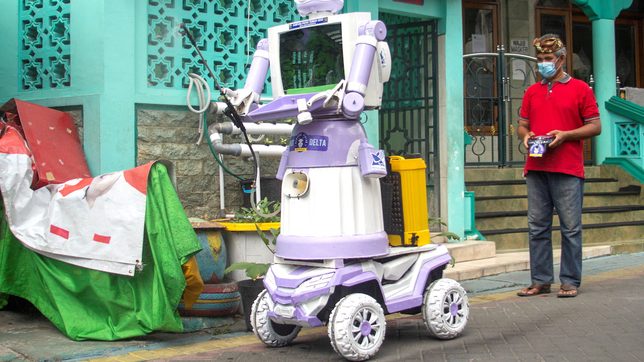 Indonesian village turns unwanted trash into robot COVID-19 helper