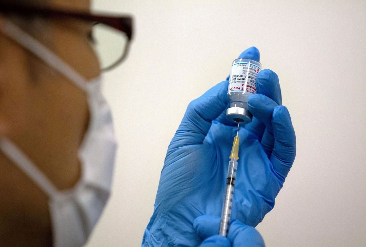 Japan health minister says Okinawa vaccine contaminants likely from needle stick