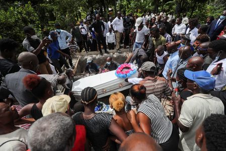 ‘I’m distraught’: Grieving Haitians bury their dead a week after quake