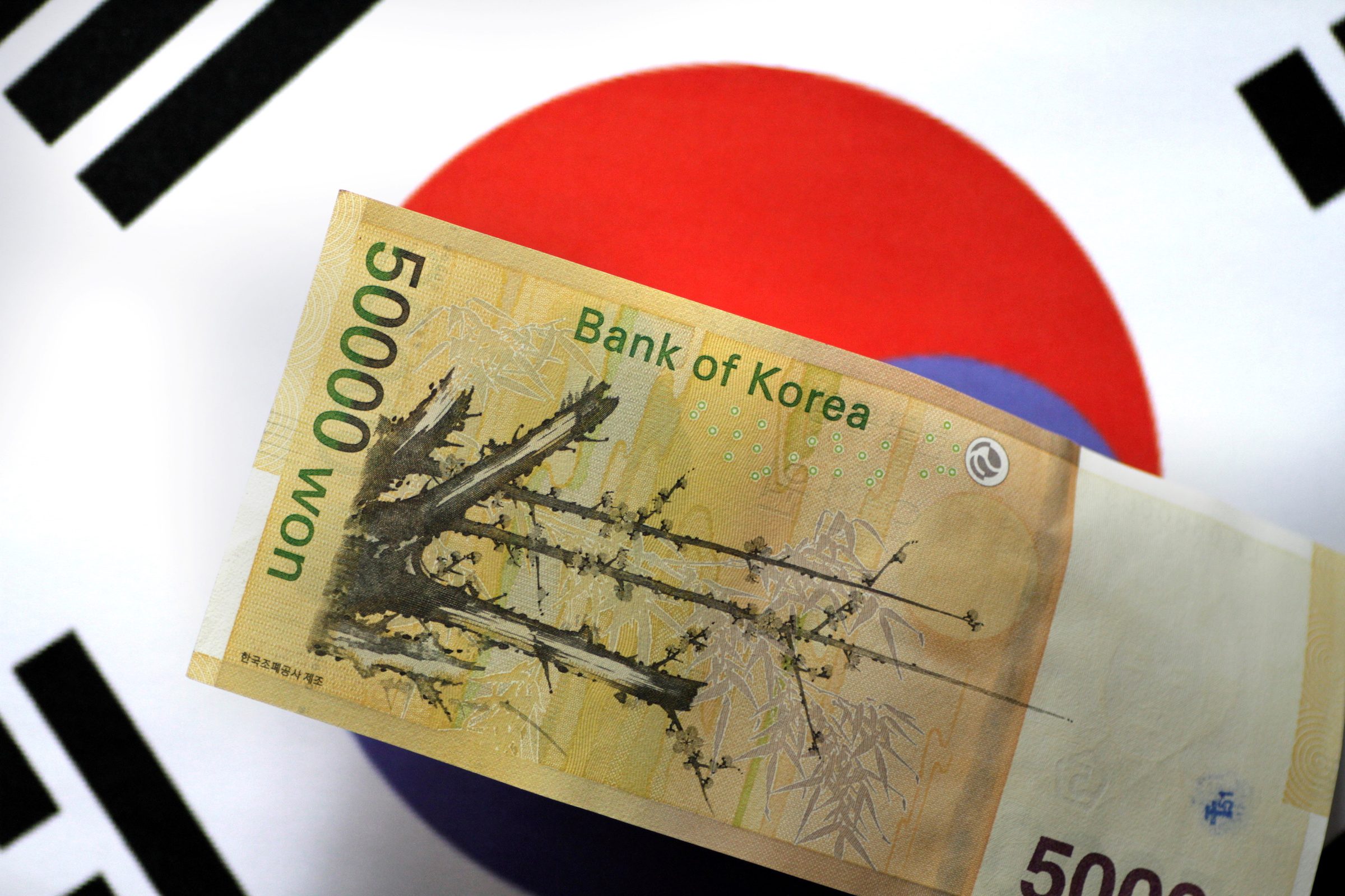 South Korea lifts interest rates from record low as debt threats grow