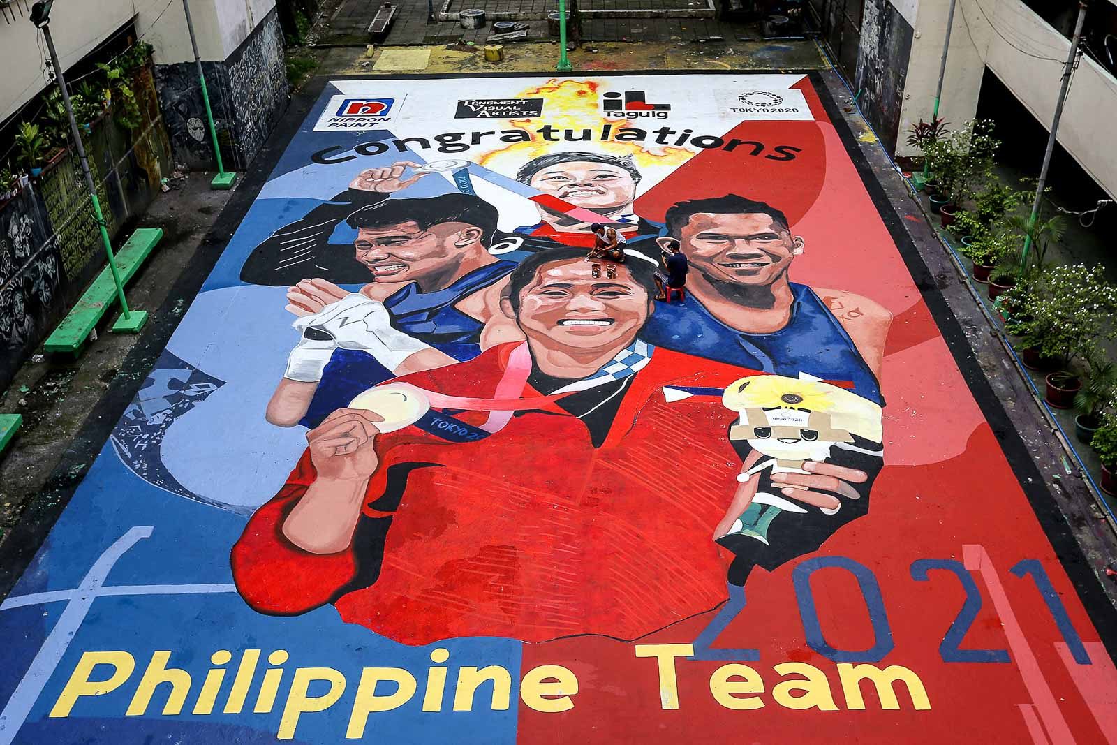 LOOK: Tenement Court in Taguig features mural of Filipino Olympic medalists