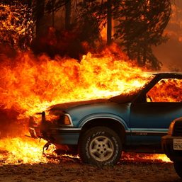 Thousands flee homes near LA as wildfires rage