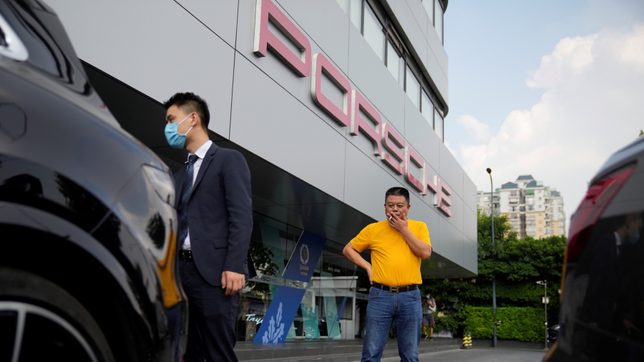 Unpaid by Evergrande, supplier sells Porsche and home to rescue his business