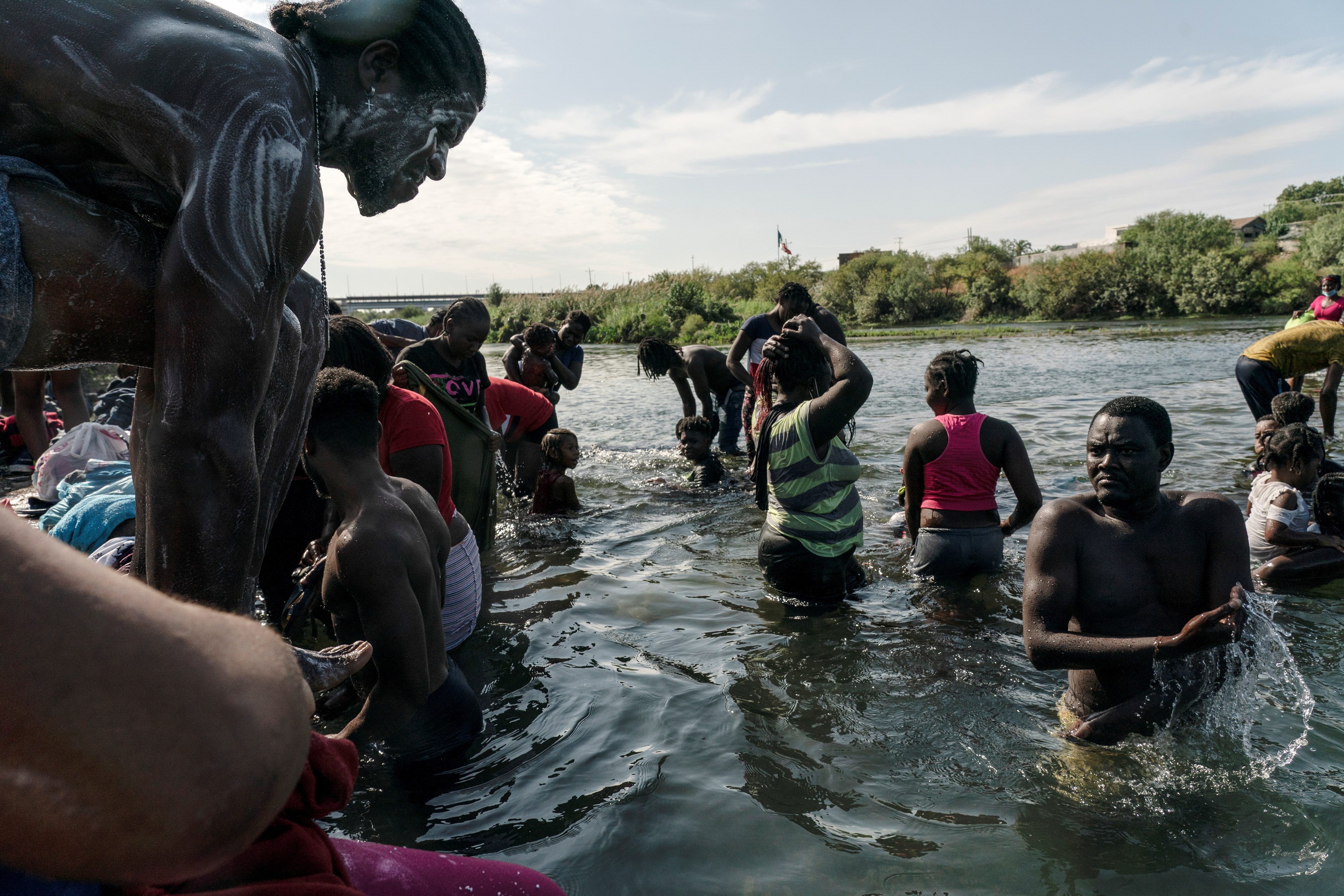 Thousands of migrants converge under Texas bridge, posing new challenge for Biden