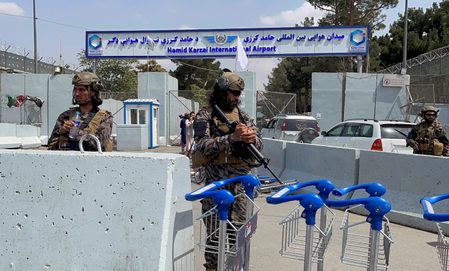 With Kabul airport closed, fearful Afghans rush for the border
