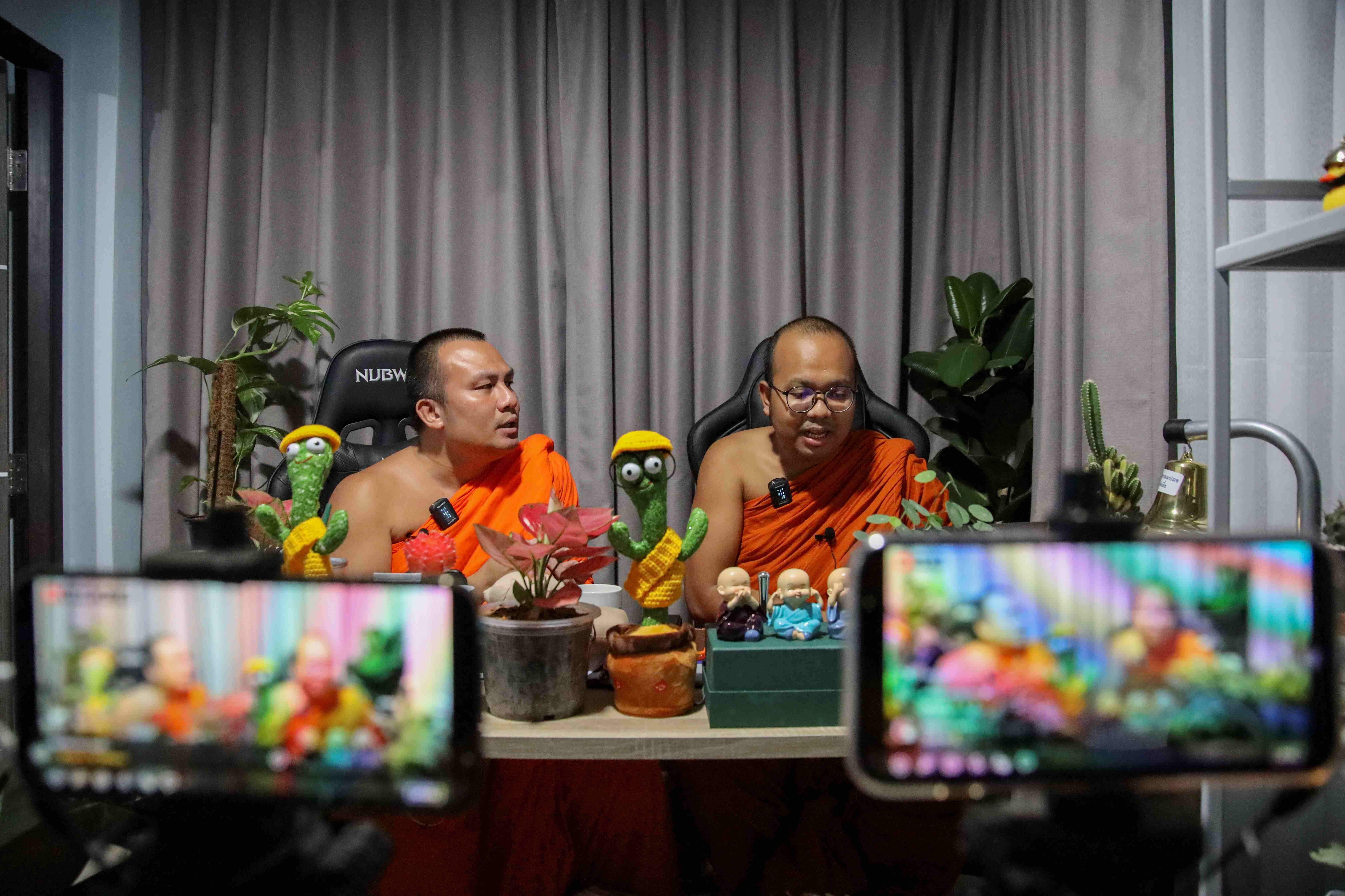 Thai monks’ livestream mixes Buddhism and jokes but not all are laughing