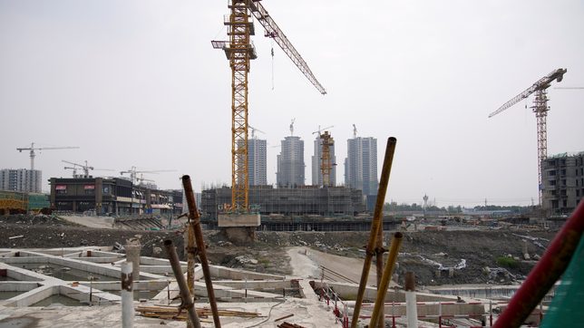 China’s troubled property behemoth averts default, signals business shift