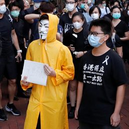 Hong Kong police swarm border town on anniversary of protest attack