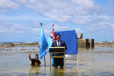 Tuvalu minister stands in sea to film COP26 speech to show climate change