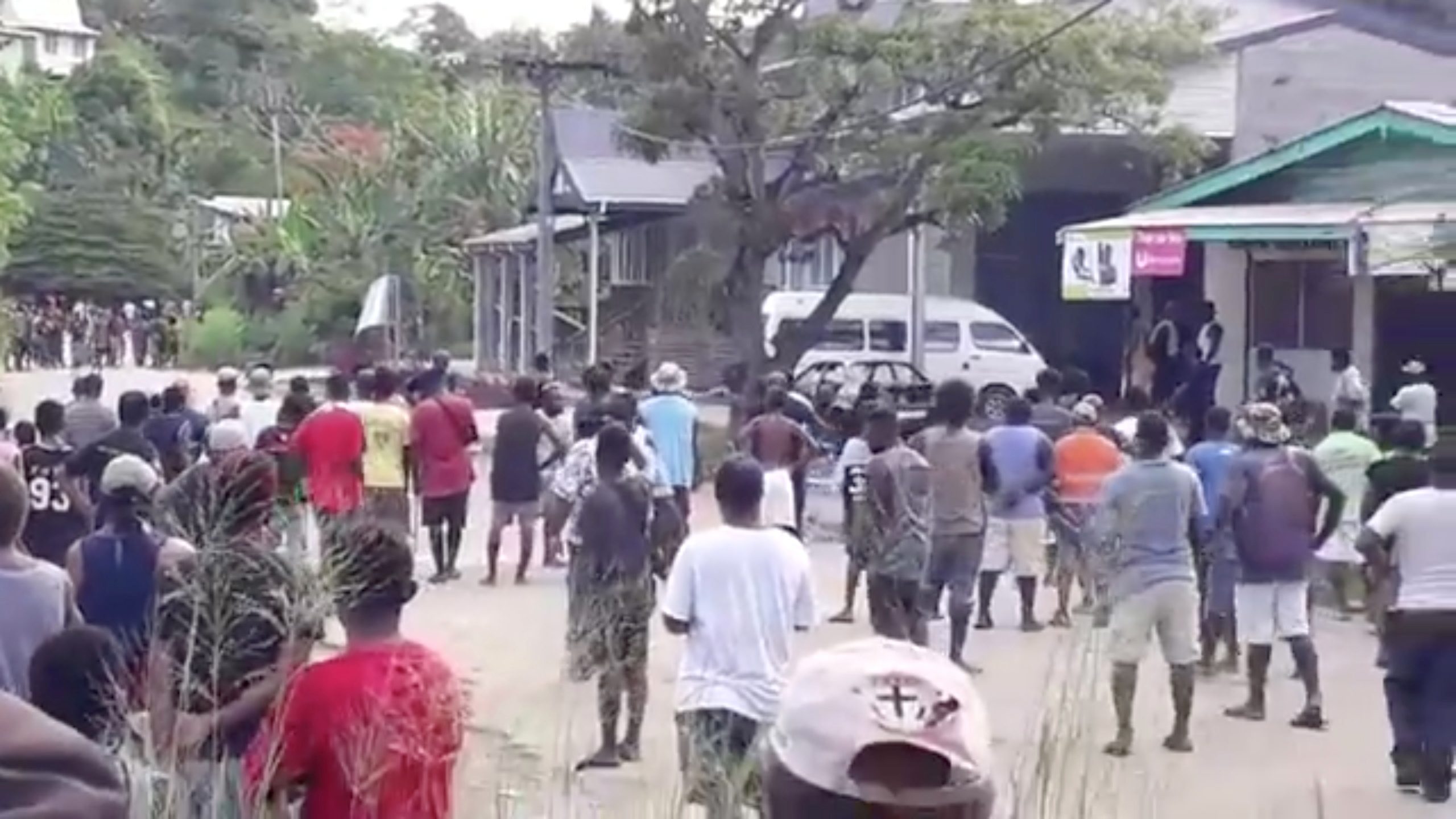 Australia security committee meets as Solomon Islanders defy lockdown, set fire to buildings