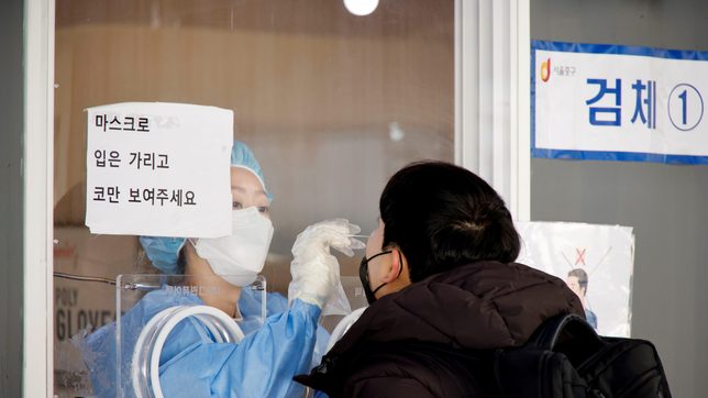 US forces in South Korea raise COVID-19 alert amid record infections