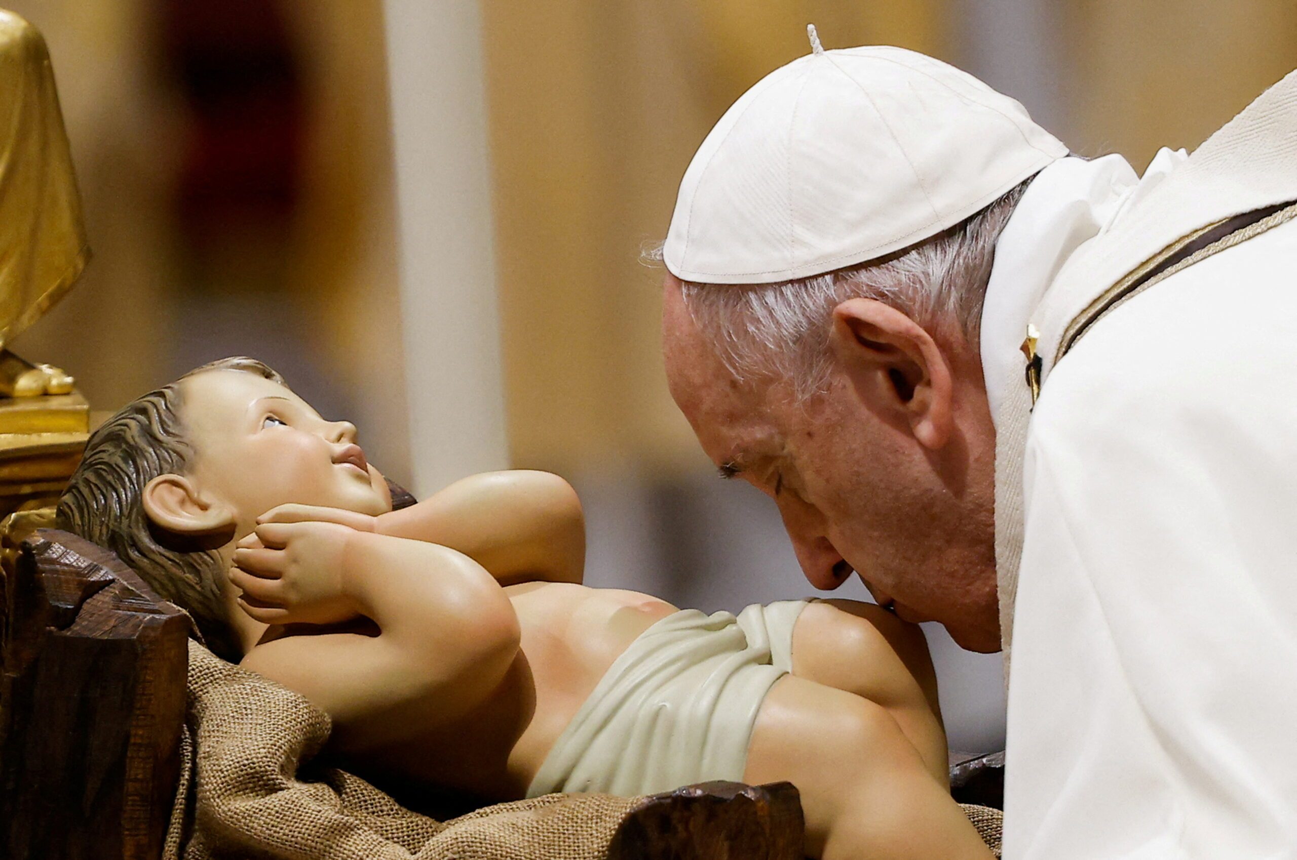 Look beyond the lights and remember the poor, pope says on Christmas eve