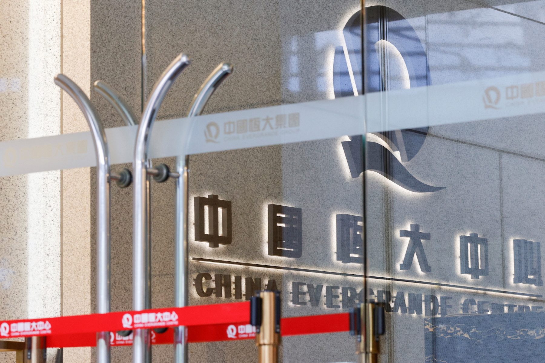 Evergrande, Kaisa cut by Fitch to default after missed payment deadlines