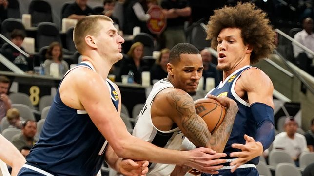 Spurs knock off road-weary Nuggets