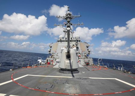 China says it warned away US warship in South China Sea; US denies