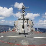 China says it warned away US warship in South China Sea; US denies