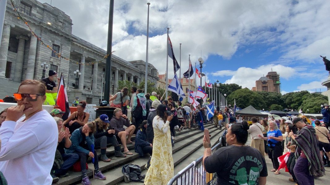COVID-19 surges in New Zealand, protesters against mandates chase away Ardern