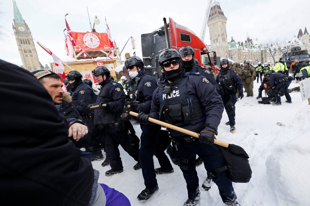 Canadian police arrest dozens to sweep protesters from parliament area