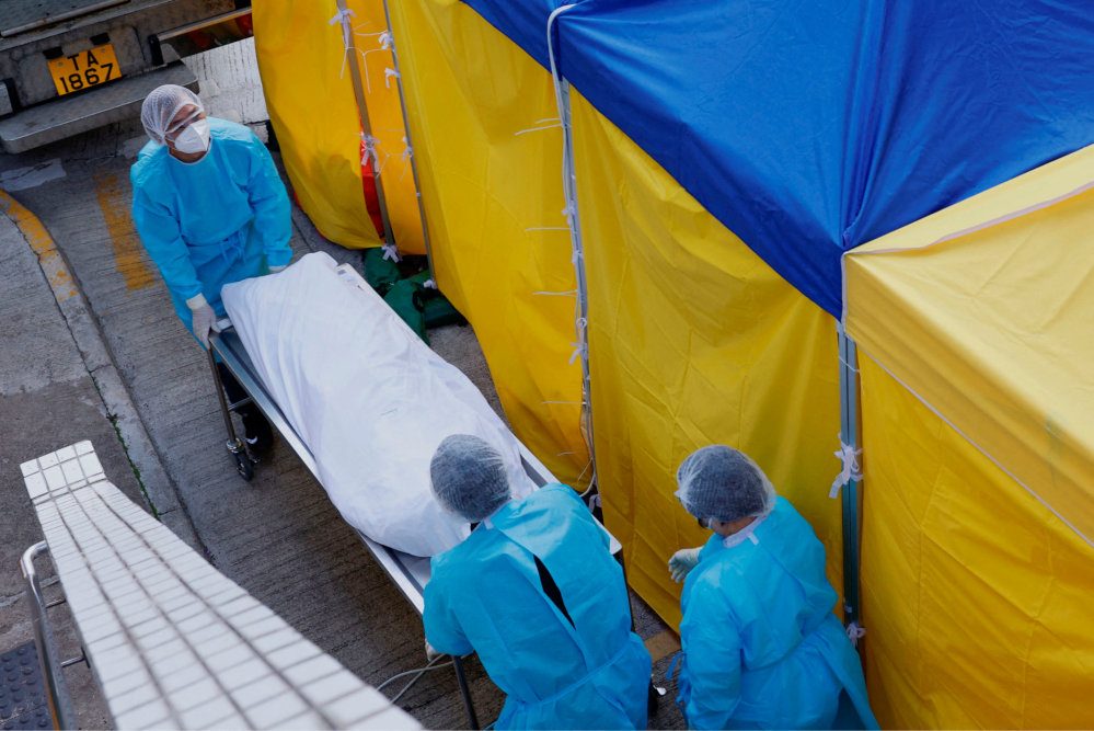 Hong Kong facilities for storing dead bodies stretched as COVID-19 deaths climb