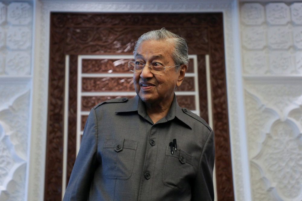Malaysia ex-PM Mahathir, 97, discharged from hospital after COVID-19 treatment