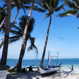 Tourist families flock to Boracay as island opens famous beach