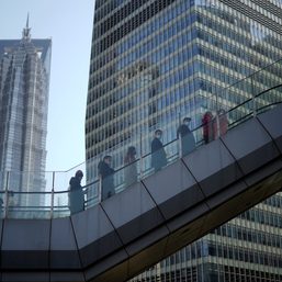 Shanghai bankers and traders hunker down as lockdown intensifies