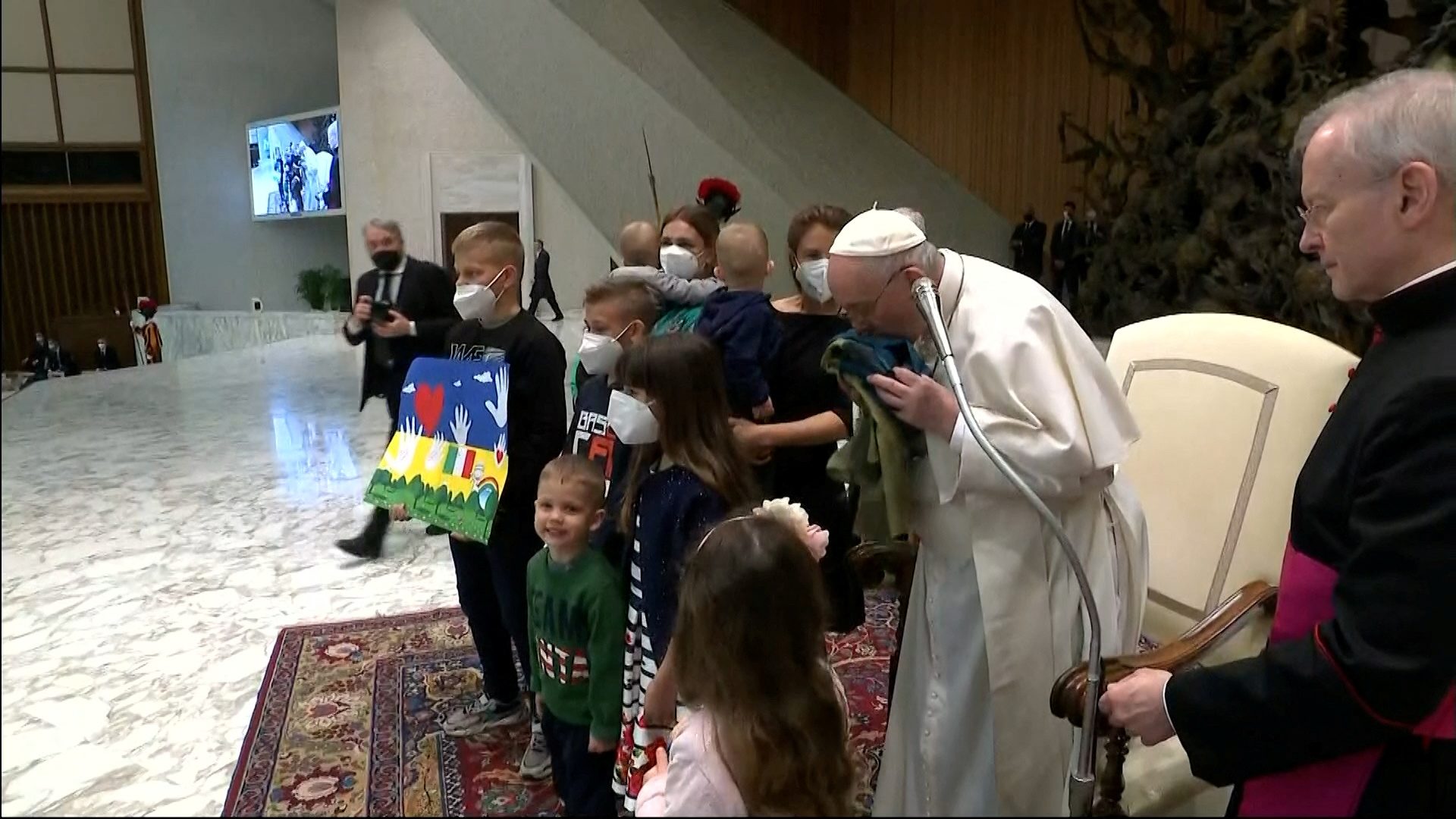 Pope kisses Ukrainian flag, condemns ‘the massacre of Bucha’