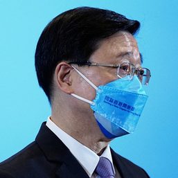 Hong Kong leader urges vaccinations as COVID-19 infections swamp city