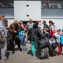 ‘We pray for Ukraine’: People flee war into central Europe