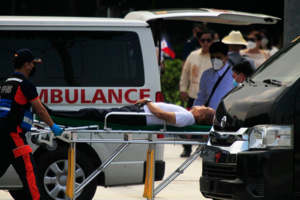 Defense Secretary Delfin Lorenzana faints during Independence Day rites