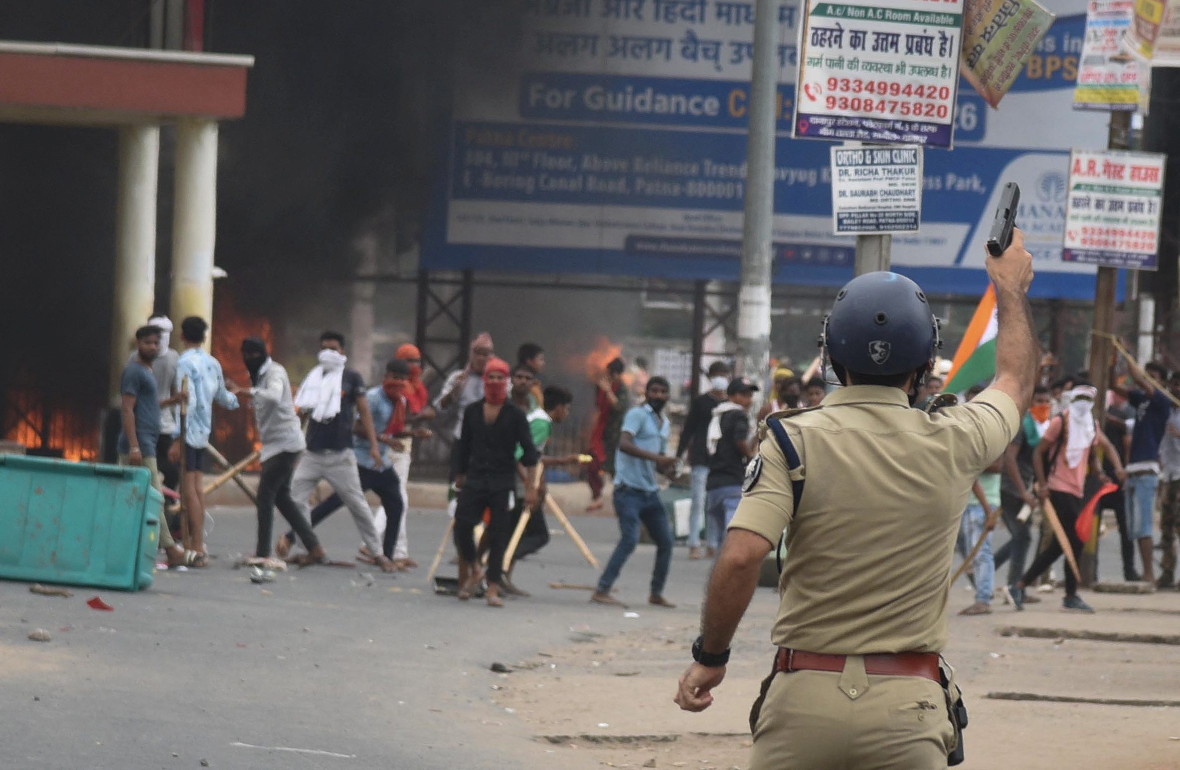 1 dead in India unrest over military hiring, some gatherings banned