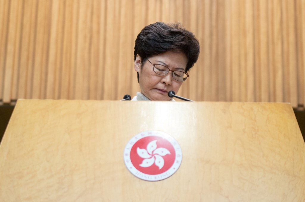 US targets Hong Kong leader, but not banks, in sanctions report