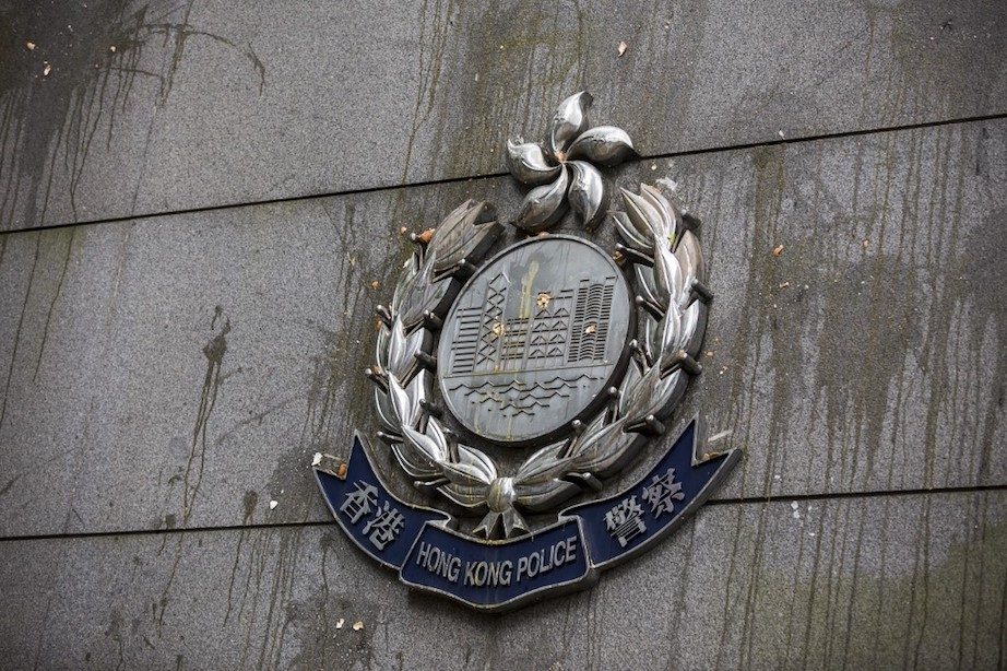 Judge says Hong Kong police were wrong to hide ID badges