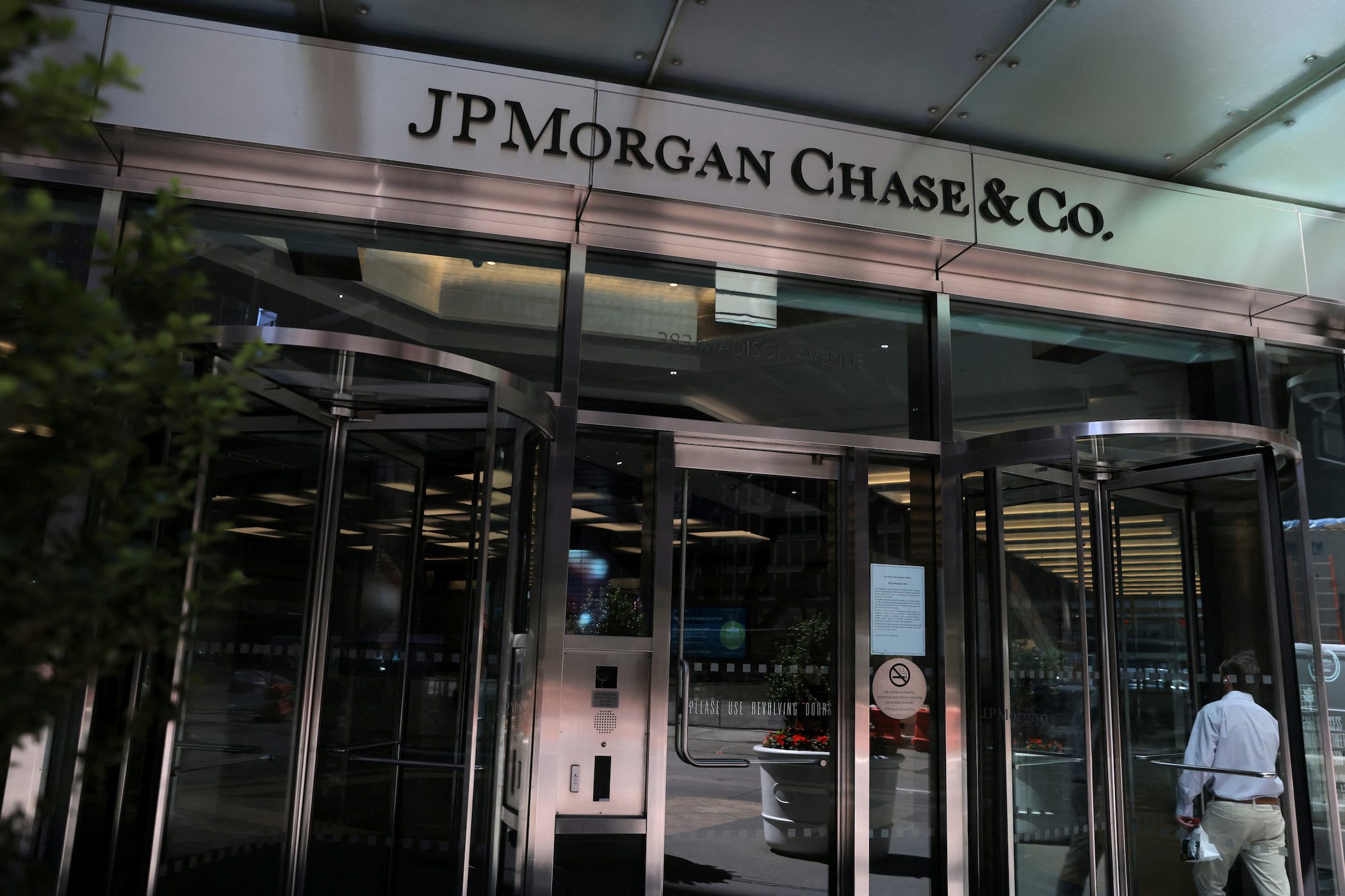 JPMorgan suspends buybacks, warns on global economy as profit slumps
