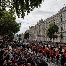 Huge crowds follow queen’s funeral in silence and awe