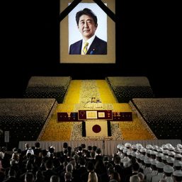 With flowers and a gun salute, Japan bids farewell to slain Abe at state funeral