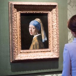 Activist glues his head to ‘Girl with a Pearl Earring’ painting in The Hague