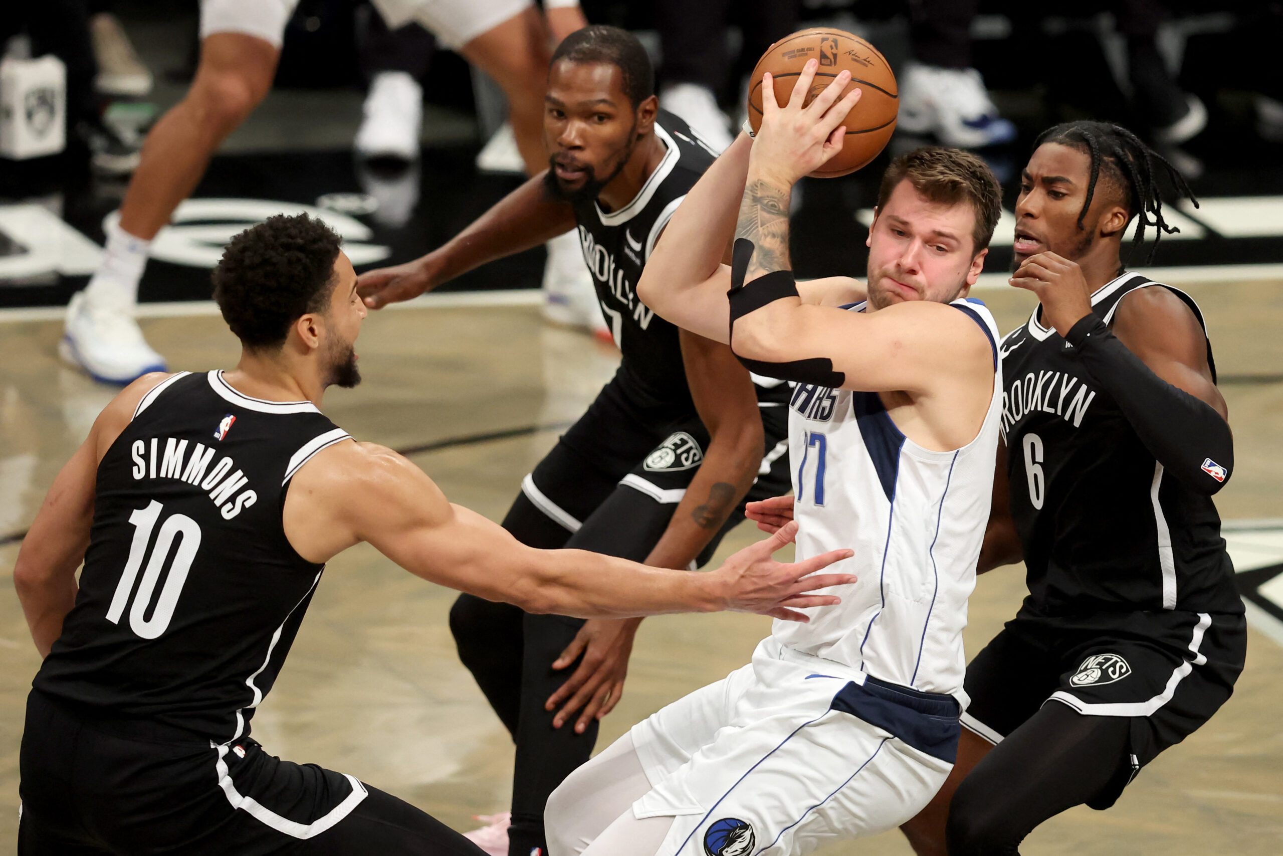 Luka Doncic tallies triple-double as Mavs hold off Nets in overtime