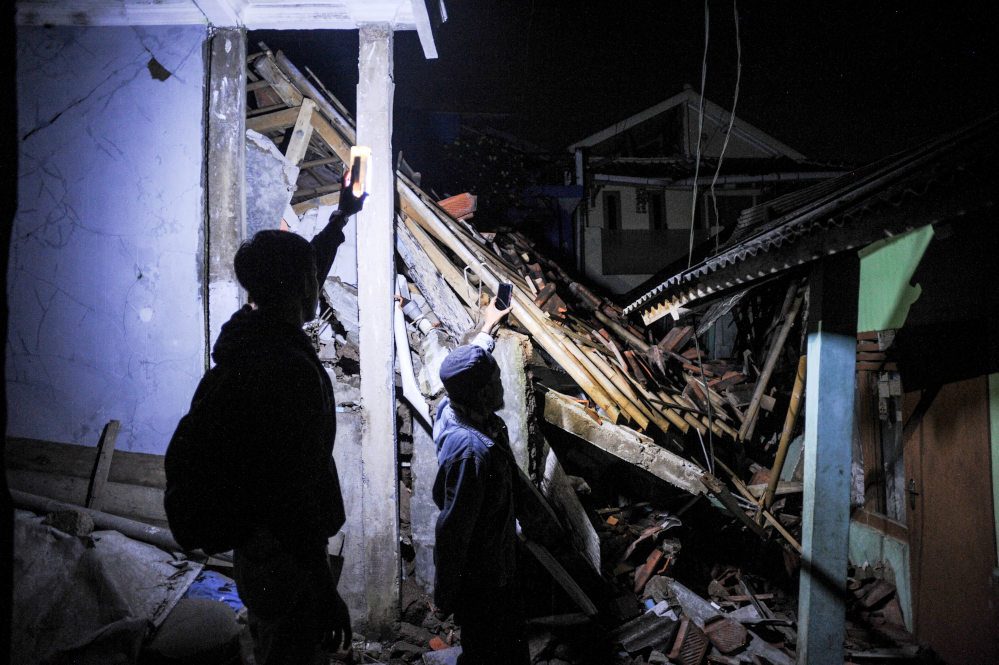 Indonesian rescue workers race to find victims trapped by deadly earthquake