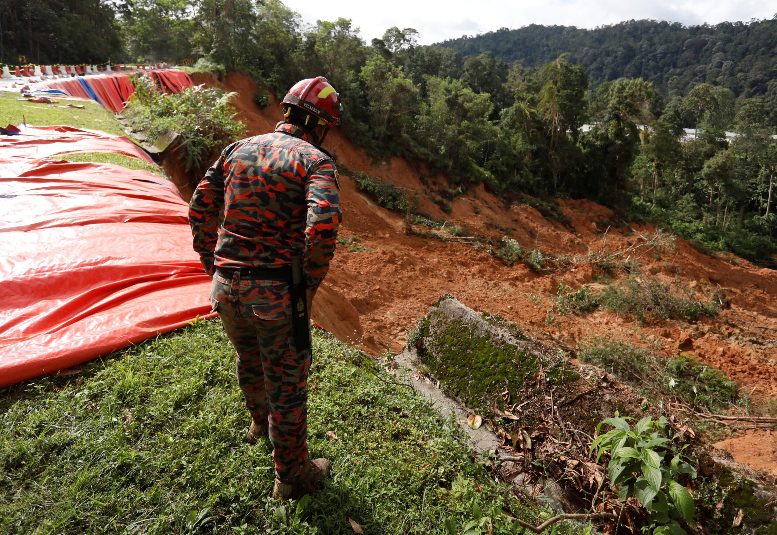 Malaysia campsite search continues as 12 still missing after deadly landslide