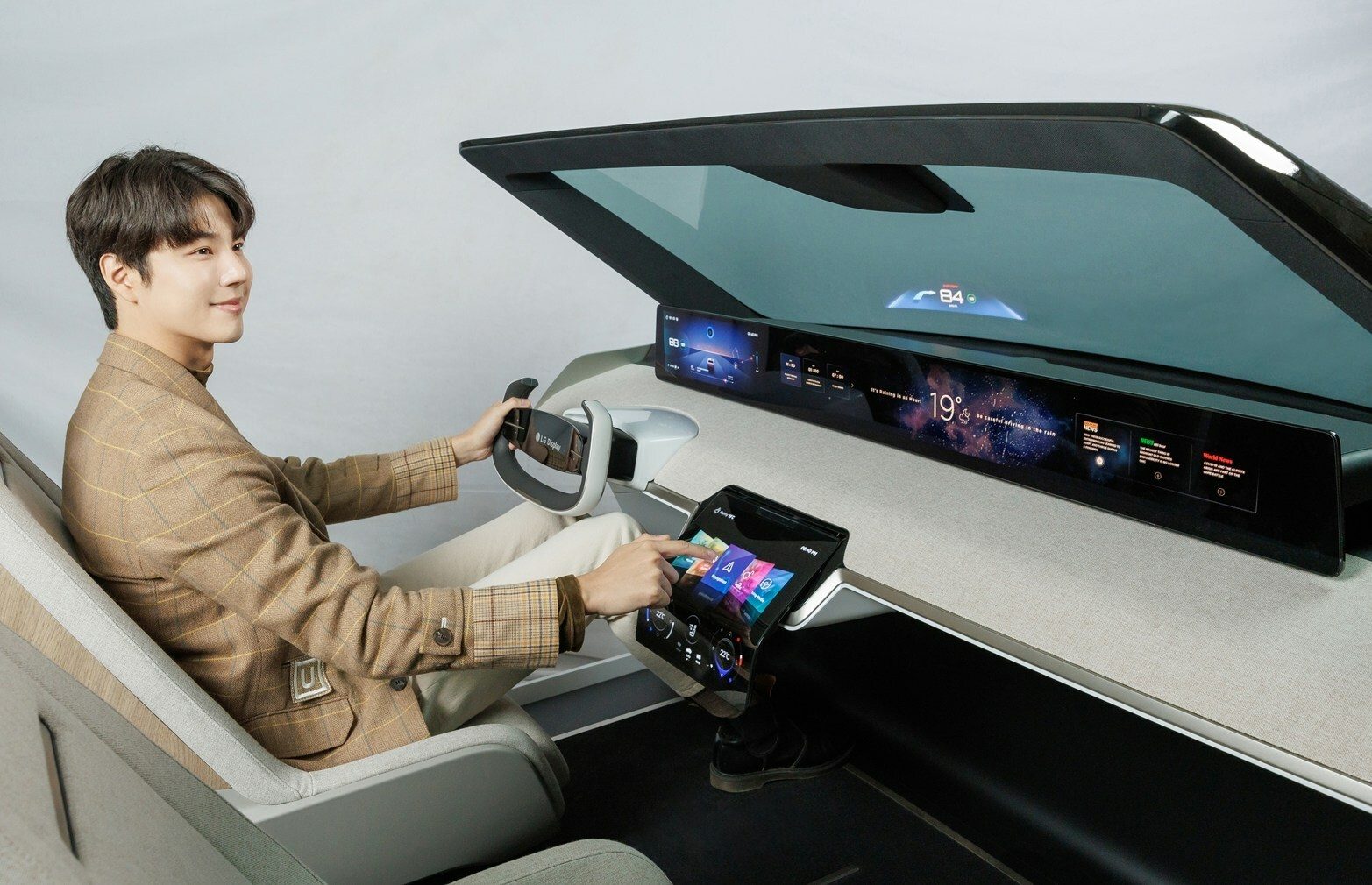 LG showcases bendable car screens, sound-producing displays for CES 2023