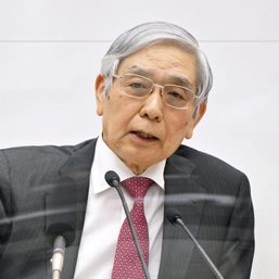 Bank of Japan defies market bets for policy tweaks, yen tumbles