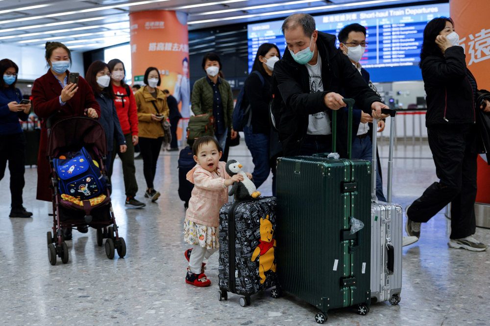 China braces for holiday COVID-19 surge as people leave megacities for hometowns