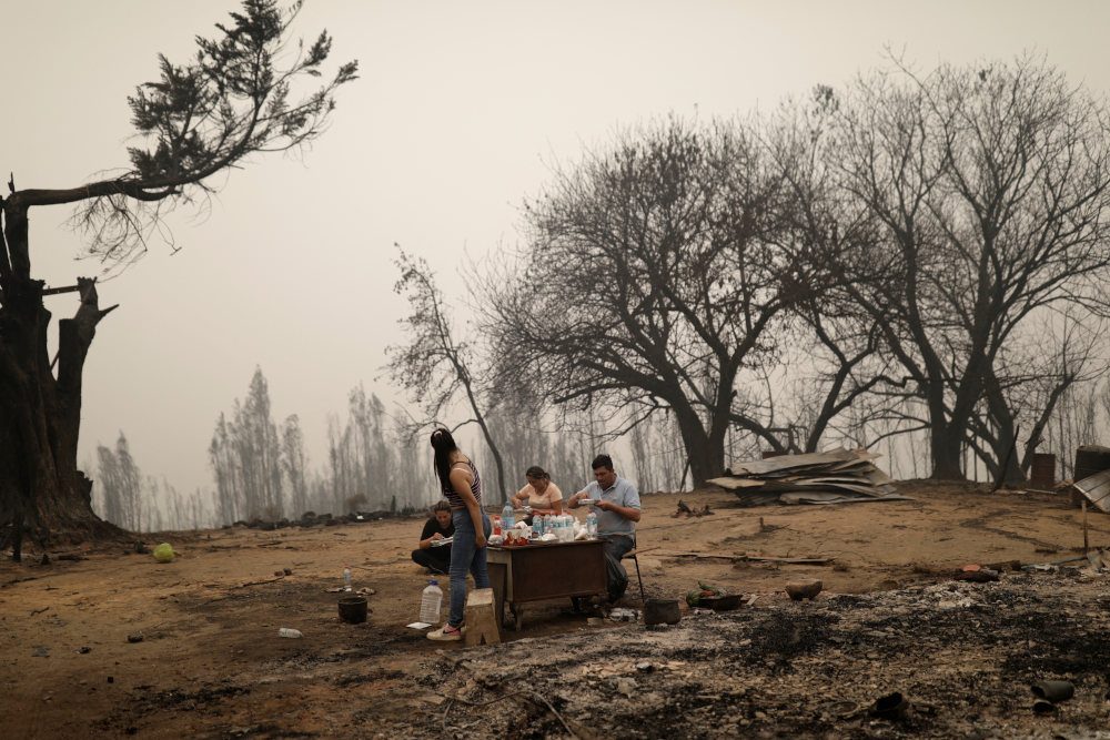At least 24 dead in Chile as wildfires spread, driving many to flee for safety