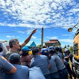 Sibuyan Island residents form human barricade to stop mining trucks